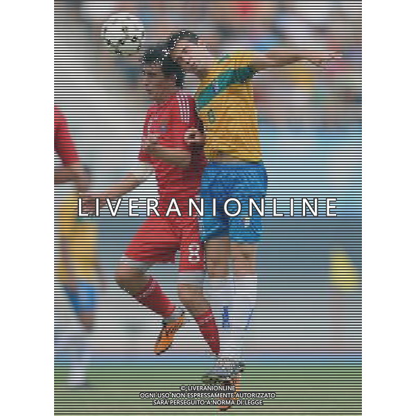 (110822) -- SHENZHEN, Aug. 22, 2011 () -- Thiago Florencio (R) of Brazil heads the ball with Artemiy Maleev of Russia during the men\'s bronze medal football match between Brazil and Russia at the 26th Summer Universiade in Shenzhen, a city of south China\'s Guangdong Province, Aug. 22, 2011. Brazil won 2-0 to win the bronze. (/Li Ga)(lm)