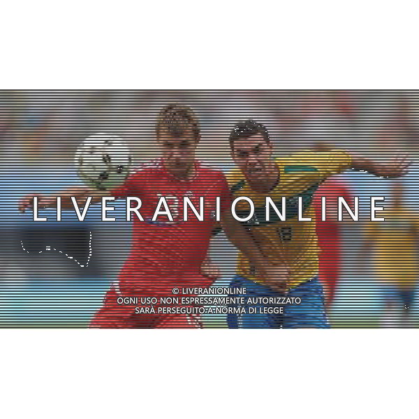 (110822) -- SHENZHEN, Aug. 22, 2011 () -- Alexandr Kozhevnikov (L) of Russia vies with Ramon Cruz of Brazil during the men\'s bronze medal football match between Brazil and Russia at the 26th Summer Universiade in Shenzhen, a city of south China\'s Guangdong Province, Aug. 22, 2011. Brazil won 2-0 to win the bronze. (/Li Ga)(lm)