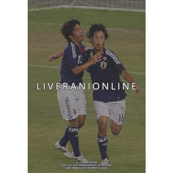 (110822) -- SHENZHEN, Aug. 22, 2011 () -- Akito Kawamoto (R) of Japan celebrates for a goal during the men\'s football final between Japan and Great Britain at the 26th Summer Universiade in Shenzhen, a city of south China\'s Guangdong Province, Aug. 22, 2011. Japan won 2-0 to win the gold. (/Bai Xuefei)(lm)