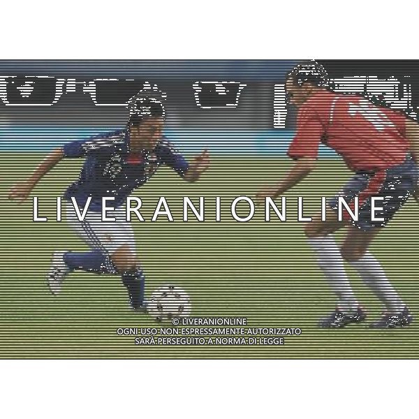 (110822) -- SHENZHEN, Aug. 22, 2011 () -- Nobuyuki Shiina (L) of Japan competes during the men\'s football final between Japan and Great Britain at the 26th Summer Universiade in Shenzhen, a city of south China\'s Guangdong Province, Aug. 22, 2011. (/Lu Hanxin)(lm)