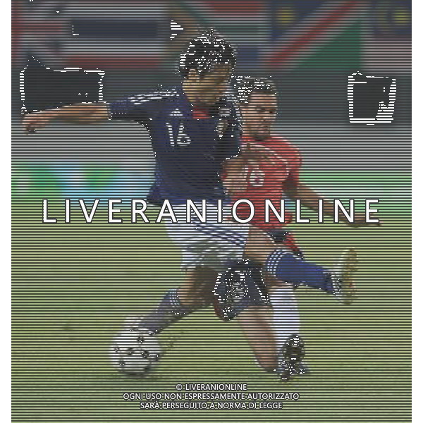 (110822) -- SHENZHEN, Aug. 22, 2011 () -- Akito Kawamoto (L) of Japan vies with Dominic Alexander Langdon of Great Britain during the men\'s football final at the 26th Summer Universiade in Shenzhen, a city of south China\'s Guangdong Province, Aug. 22, 2011. (/Lu Hanxin)(lm)