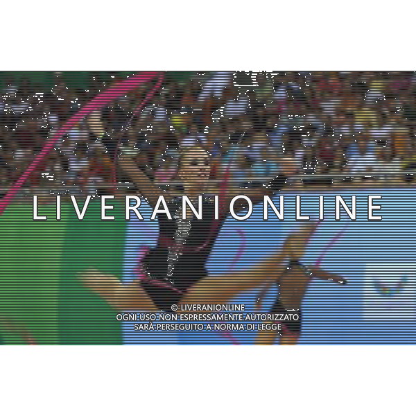 (110822) -- SHENZHEN, Aug. 22, 2011 () -- The Hungarian group competes during the 3 ribbons+2 hoops final of rhythmic gymnastics at the 26th Summer Universiade in Shenzhen, a city of south China\'s Guangdong Province, Aug. 22, 2011. The Hungarian group ranked the 4th of the event with a total of 21.000. (/Liu Dawei)