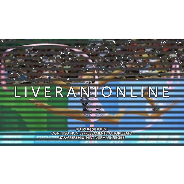 (110822) -- SHENZHEN, Aug. 22, 2011 () -- The Russian group competes during the 3 ribbons+2 hoops final of rhythmic gymnastics at the 26th Summer Universiade in Shenzhen, a city of south China\'s Guangdong Province, Aug. 22, 2011. The Russian group won the silver medal of the event with a total of 26.900. (/Liu Dawei)