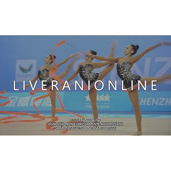 (110822) -- SHENZHEN, Aug. 22, 2011 () -- The Chinese group competes during the 3 ribbons+2 hoops final of rhythmic gymnastics at the 26th Summer Universiade in Shenzhen, a city of south China\'s Guangdong Province, Aug. 22, 2011. The Chinese group won the gold medal of the event with a total of 27.100. (/Liu Dawei)