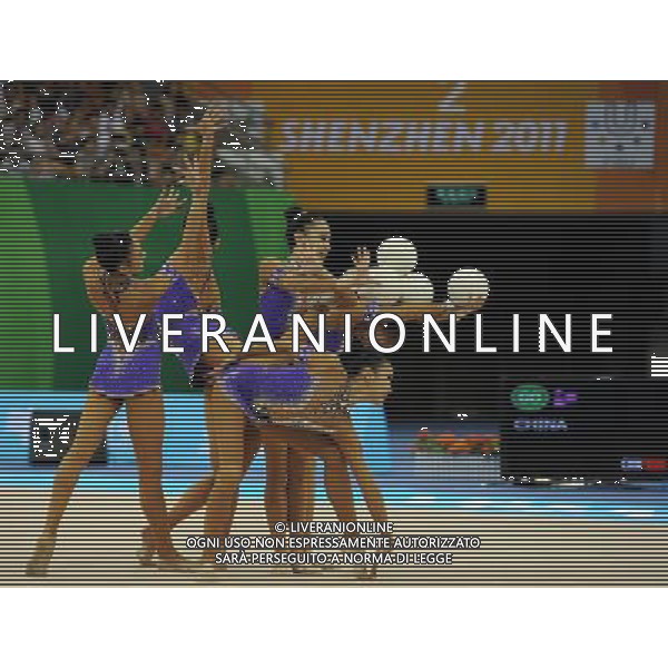 (110822) -- SHENZHEN, Aug. 22, 2011 () -- The Chinese group competes during the 5 balls final of rhythmic gymnastics at the 26th Summer Universiade in Shenzhen, a city of south China\'s Guangdong Province, Aug. 22, 2011. The Chinese group won the gold medal of the event with a total of 26.950. (/Guo Yong)