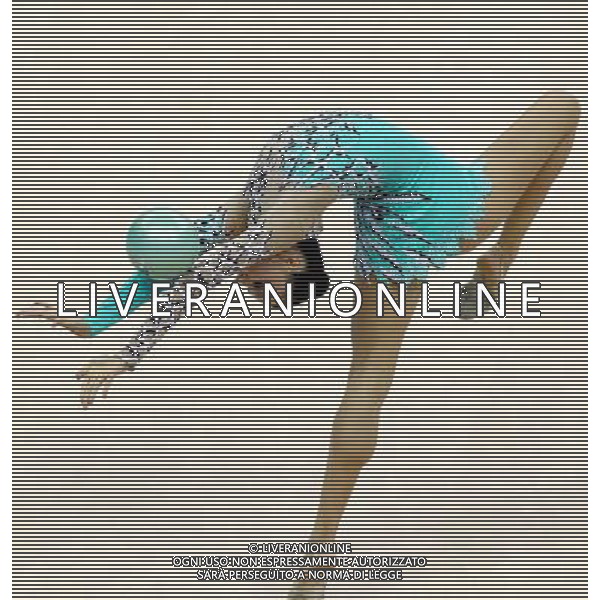(110822) -- SHENZHEN, Aug. 22, 2011 () -- Liubou Charkashyna of Belarus competes during the individual ball final of rhythmic gymnastics at the 26th Summer Universiade in Shenzhen, a city of south China\'s Guangdong Province, Aug. 22, 2011. Liubou Charkashyna won the bronze medal of the event with a total of 28.200. (/Chen Jianli)