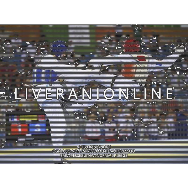 (110823) -- SHENZHEN, Aug. 23, 2011 () -- Umut Bildik (L) of Turkey competes with Stevens Barclais of France during men\'s -63kg match of taekwondo at the 26th Summer Universiade in Shenzhen, a city of south China\'s Guangdong Province, on Aug. 23, 2011. Umut Bildik won Stevens Barclais 5-4 to get the gold medal. (/Liang Xu)(wx)