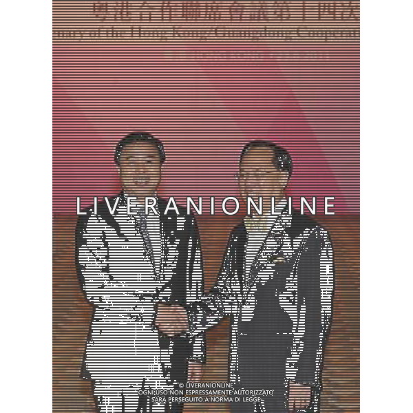 (110823) -- HONG KONG, Aug. 23, 2011 () -- Hong Kong Chief Executive Donald Tsang (R) and Guangdong Governor Huang Huahua shake hands before attending the 14th Plenary of the Hong Kong/Guangdong Cooperation Joint Conference in Hong Kong, south China, Aug. 23, 2011. (/Wong Pun Keung) (ry)