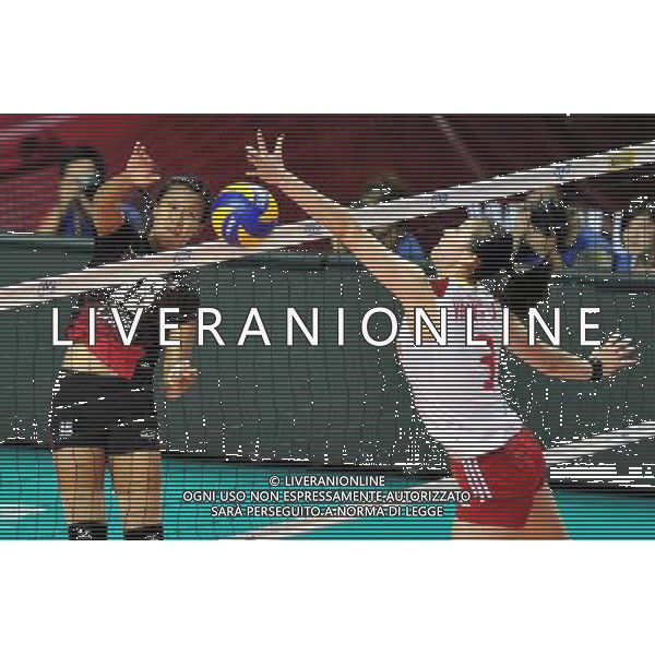 (110825) -- MACAO, Aug. 25, 2011 () -- Thai player Malika Kanthong (L) spikes the ball during the group A match against China at the 2011 FIVB World Grand Prix in Macao, south China, Aug. 25, 2011. Thailand won 3-1. (/Lo Ping Fai)
