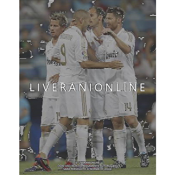 Real Madrid\'s Karim Benzema celebrates goal with Xabi Alonso, Fabio Coentrao and Ricardo Carvalho during Santiago Bernabeu Cup on august 24th 2011. Photo: Cesar Cebolla / ALFAQUI