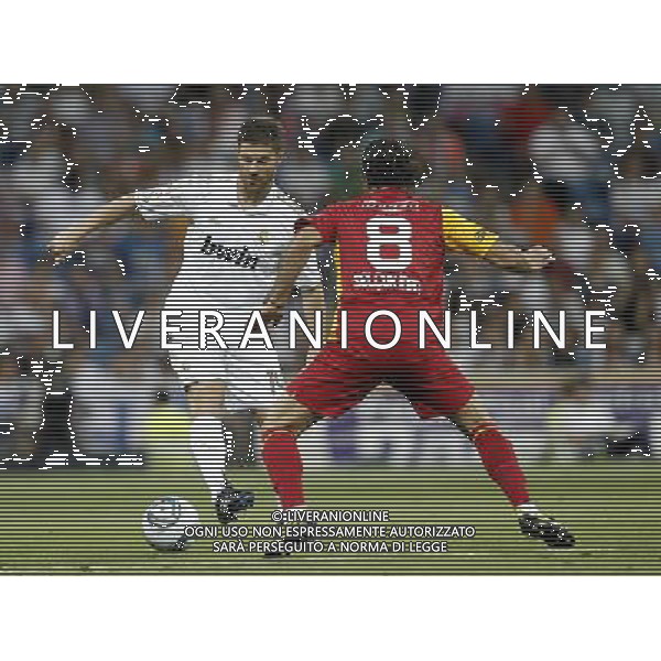 Real Madrid\'s Xabi Alonso and Galatasaray\'s Selcukinan during Santiago Bernabeu Cup on August 24th 2011. Photo: Cesar Cebolla / ALFAQUI