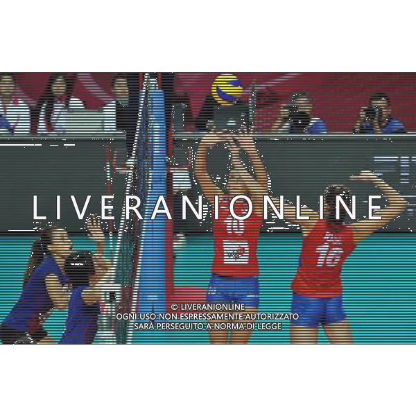 MACAO, Aug. 26, 2011 Serbian player Maja Ognjenovic (2nd R) lifts the ball during the group A match against Thailand at 2011 FIVB World Grand Prix in Macao, south China, Aug. 26, 2011. Serbia won 3 0. (/Lo Ping Fai)