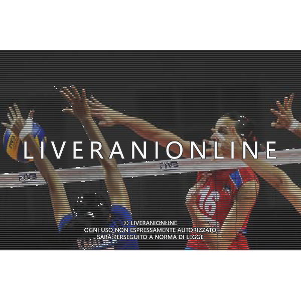 MACAO, Aug. 26, 2011 Serbian player Milena Rasic (R) spikes the ball during the group A match against Thailand at 2011 FIVB World Grand Prix in Macao, south China, Aug. 26, 2011. Serbia won 3 0. (/Cheong Kam Ka)