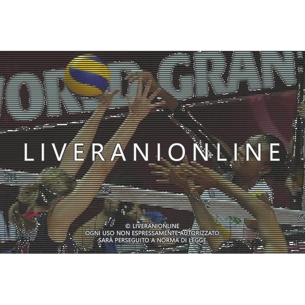 MACAO, Aug. 26, 2011 Fabiana Claudino (R) of Brazil spikes the ball during the group B match against the United States at 2011 FIVB World Grand Prix in Macao, south China, Aug. 26, 2011. Brazil won 3 1. (/Cheong Kam Ka)