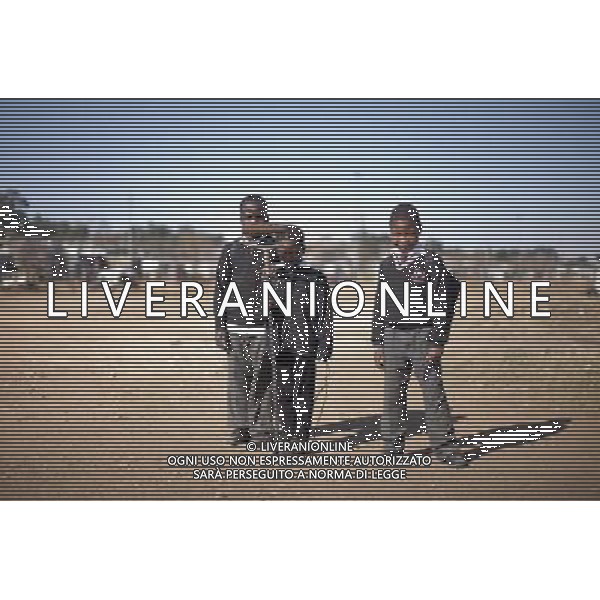 JOHANNESBURG , Sept. 01, 2011 9 year old Sipho Jama (C), with his friends Yanga Zomco (L) and Nzaliseko Nguye, holds a roller brush with a burnt handle in Motswaledi Informal settlement of Soweto, Johannesburg, South Africa, Aug. 24, 2011. Children in the shanty towns don\'t have fancy toys like transformers, barbies or remote control airplanes, but they have a lot of fun playing with a piece of wire, a ball, a discarded circuit board or even a piece of paper. These so called toys bring happiness to the children, though heart breaking it may seem to others. (/Fei Maohua) (xhn)