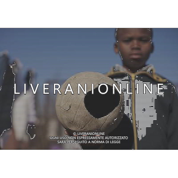 JOHANNESBURG , Sept. 01, 2011 10 year old Sesethu Ngcinasee holds a discarded soccer as toy in Motswaledi Informal settlement of Soweto, Johannesburg, South Africa, Aug. 24, 2011. Children in the shanty towns don\'t have fancy toys like transformers, barbies or remote control airplanes, but they have a lot of fun playing with a piece of wire, a ball, a discarded circuit board or even a piece of paper. These so called toys bring happiness to the children, though heart breaking it may seem to others. (/Fei Maohua) (xhn)