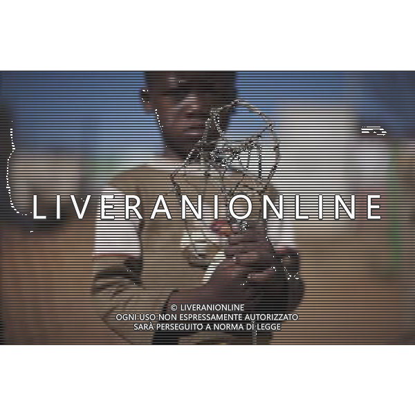 JOHANNESBURG , Sept. 01, 2011 7 year old Public Chauke poses with his new toy, a self made wire wheel in Motswaledi Informal settlement of Soweto, Johannesburg, South Africa, Aug. 24, 2011. Children in the shanty towns don\'t have fancy toys like transformers, barbies or remote control airplanes, but they have a lot of fun playing with a piece of wire, a ball, a discarded circuit board or even a piece of paper. These so called toys bring happiness to the children, though heart breaking it may seem to others. (/Fei Maohua) (xhn)