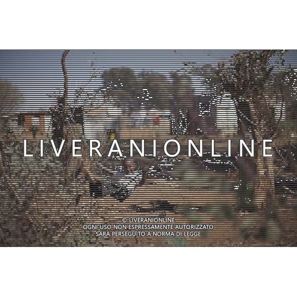 JOHANNESBURG , Sept. 01, 2011 4 year old Nhlanhla enjoys his swing made from the rubber skin of a piece of cable, in Motswaledi Informal settlement of Soweto, Johannesburg, South Africa, Aug. 25, 2011. Children in the shanty towns don\'t have fancy toys like transformers, barbies or remote control airplanes, but they have a lot of fun playing with a piece of wire, a ball, a discarded circuit board or even a piece of paper. These so called toys bring happiness to the children, though heart breaking it may seem to others. (/Fei Maohua) (xhn)