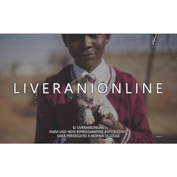 JOHANNESBURG , Sept. 01, 2011 10 year old Thulani Hlubane plays with a puppy in Orange Farm Extension in 6A Informal Settlement, Johannesburg, South Africa, Aug. 25, 2011. Children in the shanty towns don\'t have fancy toys like transformers, barbies or remote control airplanes, but they have a lot of fun playing with a piece of wire, a ball, a discarded circuit board or even a piece of paper. These so called toys bring happiness to the children, though heart breaking it may seem to others. (/Fei Maohua) (xhn)