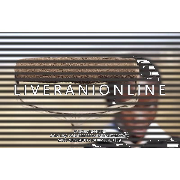 JOHANNESBURG , Sept. 01, 2011 9 year old Sipho Jama holds a roller brush with a burnt handle in Motswaledi Informal settlement of Soweto, Johannesburg, South Africa, Aug. 24, 2011. Children in the shanty towns don\'t have fancy toys like transformers, barbies or remote control airplanes, but they have a lot of fun playing with a piece of wire, a ball, a discarded circuit board or even a piece of paper. These so called toys bring happiness to the children, though heart breaking it may seem to others. (/Fei Maohua) (xhn)