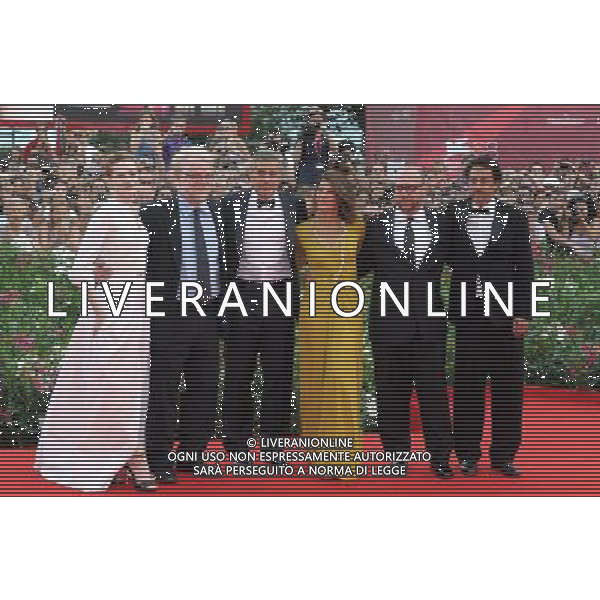 (110831) -- VENICE, Aug. 31, 2011 () -- U.S. director and actor George Clooney (3rd L) and cast members of the opening film \'The Ides of March\', pose for photos on the red carpet during the opening of the 68th Venice International Film Festival in Venice, Italy, Aug. 31, 2011. (/Wang Qingqin)