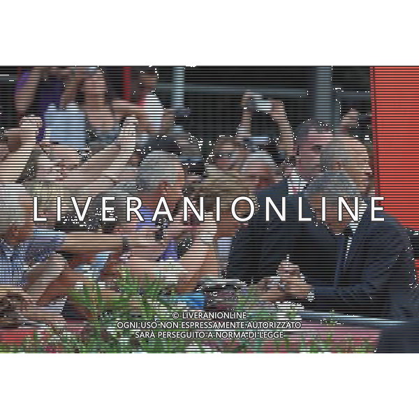 (110831) -- VENICE, Aug. 31, 2011 () -- U.S. director and actor George Clooney (1st R) of the opening film \'The Ides of March\' signs for fans on the red carpet during the opening of the 68th Venice International Film Festival in Venice, Italy, Aug. 31, 2011. (/Wang Qingqin)