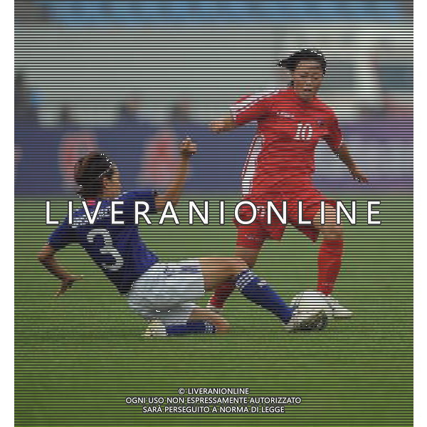 JINAN, Sept. 8, 2011 The Democratic People\'s Republic of Korea (DPRK)\'s Kim Yong Ae (R) is confronted Japan\'s Iwashimizu Azusa during their match at the Asian women\'s football qualifier for the 2012 London Olympics in Jinan, east China\'s Shandong Province, Sept. 8, 2011. The match ended in a 1 1 draw. (/Fan Changguo)(dx)