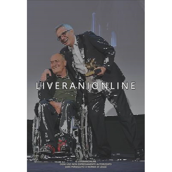 (110910) -- VENICE, Sept. 10, 2011 () -- Italian filmmaker Marco Bellocchio (R) is awarded the Golden Lion for Lifetime Achievement by compatriot, director Bernardo Bertolucci, at the 68th Venice International Film Festival in Venice, Italy, Sept. 9, 2011. (/Wang Qingqin) (hdt)
