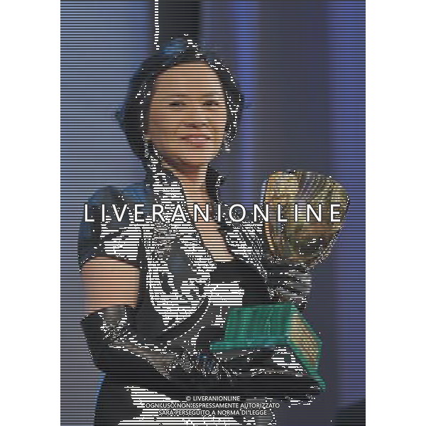 (110910) -- VENICE, Sept. 10, 2011 () -- Chinese Hong Kong actress Deanie Yip receives the Best Actress Award for her role in the film \'Taojie (A Simple Life)\' at the awarding ceremony of the 68th Venice Film Festival in Venice, Italy, Sept. 10, 2011. (/Wang Qingqin) (wjd)