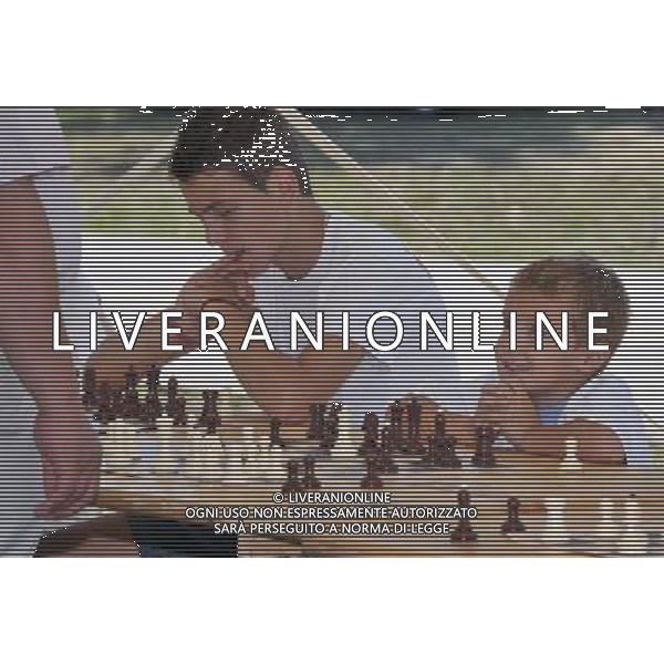 (110910) -- ZAGREB, Sept. 10, 2011 () -- Chess fans play chess against former European chess champion Zdenko Kozul during a celebration to mark the 20th founding anniversary of the Croatian Olympic Committee at Jarun Lake in Zagreb, Croatia, Sept. 10, 2011. The Croatian Olympic Committee was founded in Zagreb on Sept. 10, 1991. (/Miso Lisanin)