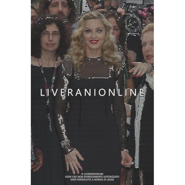 Madonna surprises fans by stepping out for a wave after the doing the red carpet at the premiere of W.E., a movie about the affair between King Edward VIII and American divorcÈe Wallis Simpson. Madonna is the Director as well as star of the film at the Toronto International Film Festival September 12, 2011 -