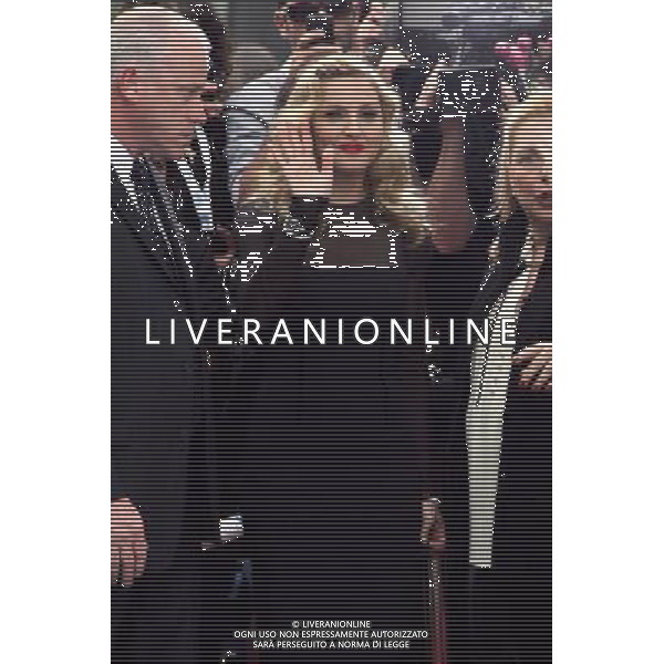 Madonna surprises fans by stepping out for a wave after the doing the red carpet at the premiere of W.E., a movie about the affair between King Edward VIII and American divorcÈe Wallis Simpson. Madonna is the Director as well as star of the film at the Toronto International Film Festival September 12, 2011 -