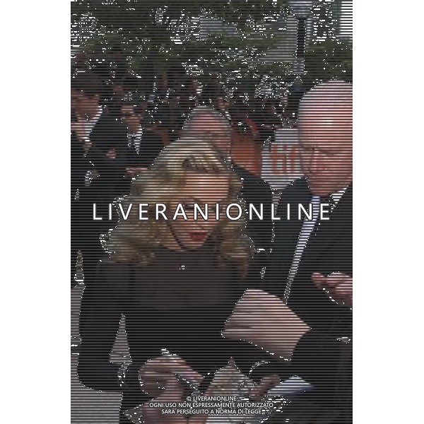 Madonna arrives on the red carpet at the premiere of W.E., a movie about the affair between King Edward VIII and American divorcÈe Wallis Simpson. Madonna is the Director as well as star of the film at the Toronto International Film Festival September 12, 2011 -