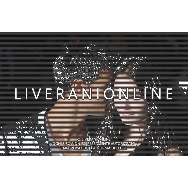 Taylor Lautner, Lily Collins, Taylor Lautner whispers in Lily Collin\'s ear, The European Premiere of Abuction, BFI IMax, Southbank, London. 26.09.11 /AG. ALDO LIVERANI SAS- ITALY ONLY *** Local Caption *** .