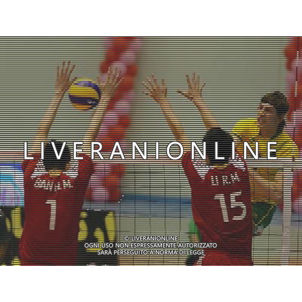 (110926) -- TEHRAN, Sept. 26, 2011 () -- Australia\'s Igor Yudin (R) spikes the ball during the match against China at the 16th Asian Men\'s Volleyball Championship in Tehran, capital of Iran, on Sept. 26, 2011. Australia won 3-1. (/Ahmad Halabisaz) / Tehran, Iran , Campionato maschile di Volley Cina VS Australia - AG. ALDO LIVERANI SAS- ITALY ONLY *** Local Caption *** .