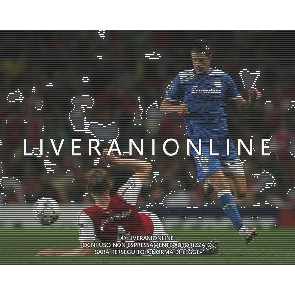 Olympiacos Kevin Mirallas is challenged by Arsenal\'s Per Mertesacker Football - UEFA Champions League - Group F - Arsenal v Olympiacos FC - Wed 28 Sep 2011 - Emirates Stadium - London - UK Foto: Michal Zemanek / Newspix.pl LIGA MISTRZOW SEZON 2011/2012 PILKA NOZNA ARSENAL LONDYN vs OLYMPIAKOS PIREUS --- Newspix.pl ARSENAL OLYMPIACOS - CHAMPIONS LEAGUE - ©AG ALDO LIVERANI SAS ITALY ONLY -. *** Local Caption *** .