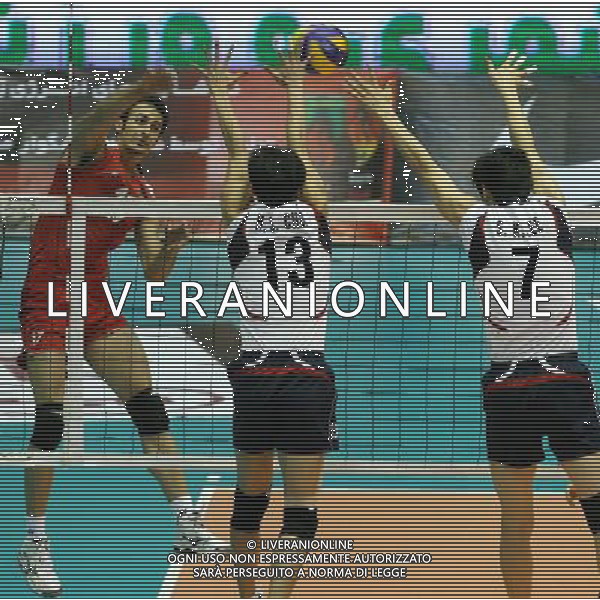 (110929) TEHRAN, Sept. 29, 2011 () Arash Kamalvand (L) of Iran spikes the ball during the semifinal against South Korea at the 16th Asian Men\'s Volleyball Championship in Tehran, Iran, Sept. 28, 2011. Iran won 3 1 to advance to the final. (/Ahmad Halabisaz) / Tehran, Iran , Campionato maschile di Volley - AG. ALDO LIVERANI SAS- ITALY ONLY *** Local Caption *** .