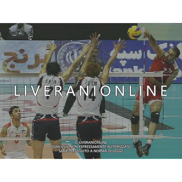 (110929) TEHRAN, Sept. 29, 2011 () Hamzeh Zarini (1st R) of Iran spikes the ball during the semifinal against South Korea at the 16th Asian Men\'s Volleyball Championship in Tehran, Iran, Sept. 28, 2011. Iran won 3 1 to advance to the final. (/Ahmad Halabisaz) / Tehran, Iran , Campionato maschile di Volley - AG. ALDO LIVERANI SAS- ITALY ONLY *** Local Caption *** .