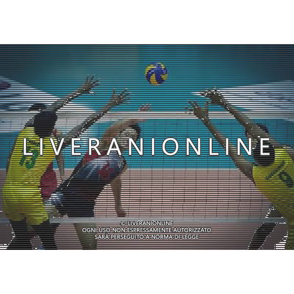 (110929) -- TEHRAN, Sept. 29, 2011 () -- Yusuke Ishijima of Japan (C) spikes the ball during the match against India at the 16th Asian Men\'s Volleyball Championship in Tehran, capital of Iran, Sept. 29, 2011. Japan won 3-2 and ranked fifth. (/Ahmad Halabisaz) / Tehran, Iran , Campionato maschile di Volley - AG. ALDO LIVERANI SAS- ITALY ONLY *** Local Caption *** .