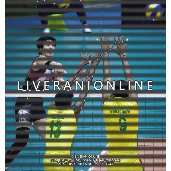 (110929) -- TEHRAN, Sept. 29, 2011 () -- Yu Koshikawa of Japan (L) spikes the ball during the match against India at the 16th Asian Men\'s Volleyball Championship in Tehran, capital of Iran, Sept. 29, 2011. Japan won 3-2 and ranked fifth. (/Ahmad Halabisaz) / Tehran, Iran , Campionato maschile di Volley - AG. ALDO LIVERANI SAS- ITALY ONLY *** Local Caption *** .