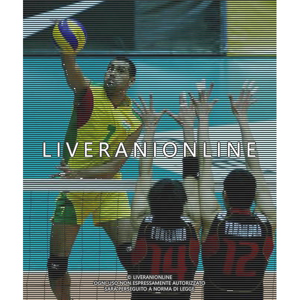 (110929) -- TEHRAN, Sept. 29, 2011 () -- Kumar Sanjay of India (L) spikes the ball during the match against Japan at the 16th Asian Men\'s Volleyball Championship in Tehran, capital of Iran, Sept. 29, 2011. Japan won 3-2 and ranked fifth. (/Ahmad Halabisaz) / Tehran, Iran , Campionato maschile di Volley - AG. ALDO LIVERANI SAS- ITALY ONLY *** Local Caption *** .