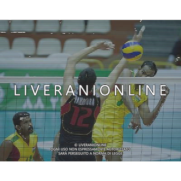 (110929) -- TEHRAN, Sept. 29, 2011 () -- Singh Sube spikes Of India (R) the ball during the match against Japan at the 16th Asian Men\'s Volleyball Championship in Tehran, capital of Iran, Sept. 29, 2011. Japan won 3-2 and ranked fifth. (/Ahmad Halabisaz) / Tehran, Iran , Campionato maschile di Volley - AG. ALDO LIVERANI SAS- ITALY ONLY *** Local Caption *** .