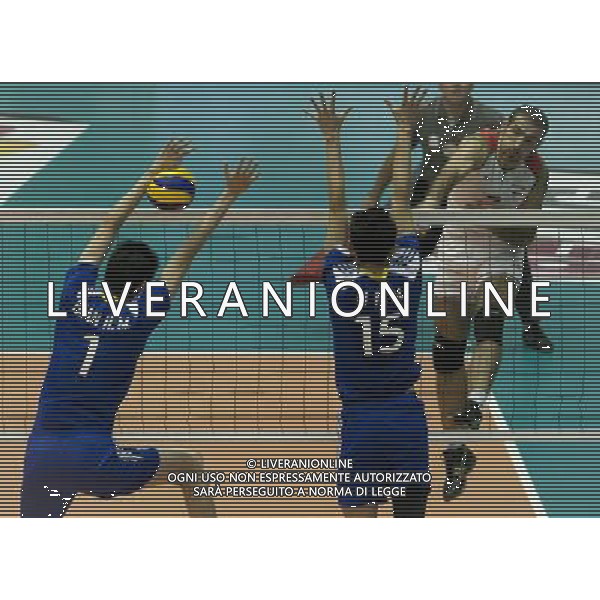 (110930) -- TEHRAN, Sept. 30, 2011 () -- Hamzeh Zarini of Iran (R) spikes the ball during the final match against China at the 16th Asian Men\'s Volleyball Championship in Tehran, capital of Iran, Sept. 29, 2011. Iran won the final 3-1 and hence the champion of the tournament on Thursday. (/Ahmad Halabisaz) / Campionato Asiatico di Volley Maschile - AG. ALDO LIVERANI SAS- ITALY ONLY *** Local Caption *** .