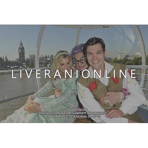 Sam Attwater, Dame Edna Everage and Anna Williamson the stars from the new wimbledon theatres pantomine Dick Whittington that runs from the 9th of December to the 15th of January went for a spin on the edf London eye 29/09/2011 - / Londra, il cast dello spettacolo teatrale Dick Whittington nel photo call di presentazione alla stampa - AG. ALDO LIVERANI SAS- ITALY ONLY *** Local Caption *** .