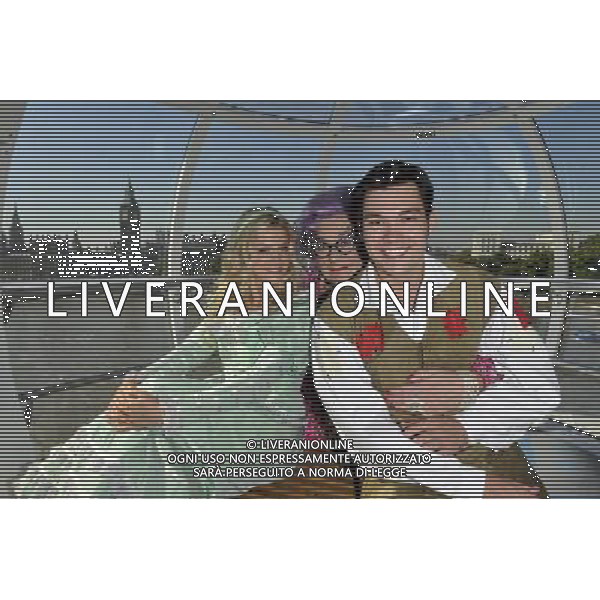 Sam Attwater, Dame Edna Everage and Anna Williamson the stars from the new wimbledon theatres pantomine Dick Whittington that runs from the 9th of December to the 15th of January went for a spin on the edf London eye 29/09/2011 - / Londra, il cast dello spettacolo teatrale Dick Whittington nel photo call di presentazione alla stampa - AG. ALDO LIVERANI SAS- ITALY ONLY *** Local Caption *** .