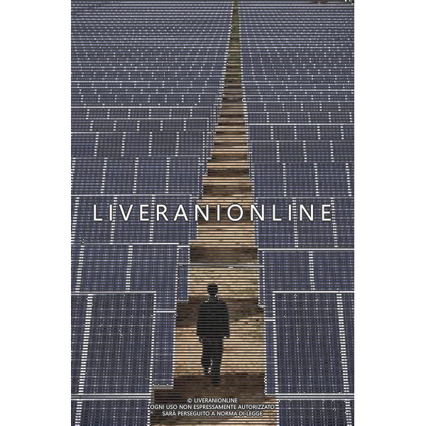 (110930) -- BEIJING, Sept. 30, 2011 () -- File photo taken on July 5, 2011 shows a worker checks solar panels in Xigaze Prefecture, southwest China\'s Tibet Autonomous Region. Can you imagine what the industry of China, now enjoys the title of \'World Factory\', was like a century ago? In 1905, when the imperial Qing government sent five senior officials to Japan and some Western countries to visit, seeking for solutions to save the decaying empire, \'Yanchang Oil Plant\', the first-ever oil enterprise in the Chinese mainland, was established in Yan\'an of northwest China\'s Shaanxi Province. In 1907, Yanchang drilled the first onshore oil well \'Yanyi Well\', starting the oil production in the Chinese mainland. However, in 1907, the oil output could only reach 1 to 1.5 tonnes per day. More than 100 years passed, Yanchang, now called Shaanxi Yanchang Petroleum (Group) Co., LTD, has made great development. In 2007, the crude oil output, oil refining and processing, and sales of oil products of Yanchang respectively exceeded 10 million tonnes, engendering it into an emerging large oilfield with the output of 10 million tonnes. Yanchang is an epitome of Chinese industry\'s centennial development since the 1911 Revolution. The 1911 Revolution, led by Dr. Sun Yat-sen, overthrew the Qing Dynasty (1644-1911) and also put an end to thousands of years of feudalist governance in China. After the revolution, Chinese industry developed as many Chinese factories, in the fields such as textile, flour, match, and steel and iron, were established at that time. However, most Chinese factories were in small scale and did not thrive for a long time. After the founding of the People\'s Republic of China in 1949, step by step, Chinese industry has formed an independent and integral modern industry system with considerable scale and relatively high technical level. Especially in the 30 years after the Chinese government implemented the reform and opening-up drive, Chi ©AG ALDO LIVERANI SAS ITALY ONLY *** Local Caption *** .