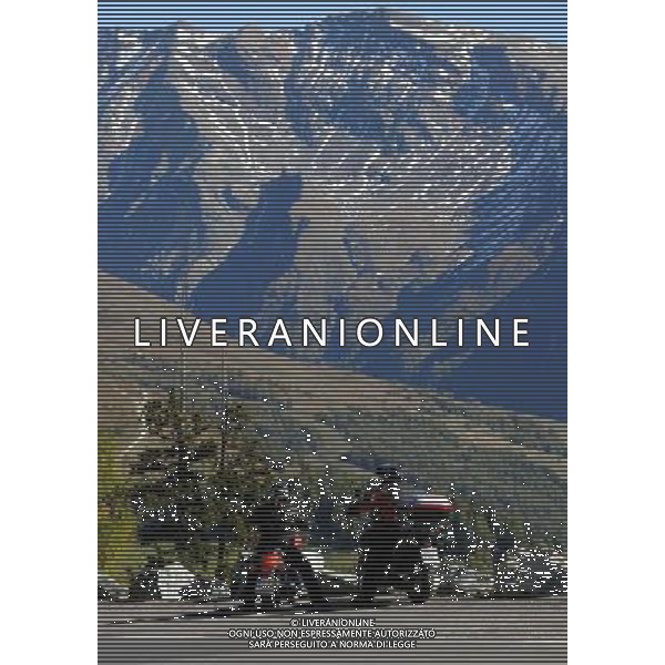 (111004) -- VIENNA, Oct. 4, 2011 () -- Motorcyclists have a rest on the side of the Grossglockner High Alpine Road in Western Austria Oct. 3, 2011. Drivers and cyclists can enjoy a view of Austria\'s highest mountain, the Grossglockner and its glacier, the Pasterze, on 48 kilometers of high alpine road with 36 bends and an altitude ascent to 2,504 meters. (/Xu Liang) (nxl) AG ALDO LIVERANI S A S ONLY ITALY