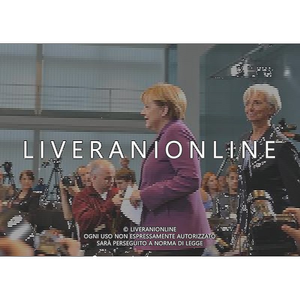 (111006) -- BERLIN, Oct. 6, 2011() -- Managing Director of International Monetary Fund (IMF) Christine Lagarde (R) and German Chancellor Angela Merkel (L) arrive for a press conference after a high-level meeting on the reform of the international monetary system in Berlin, capital of Germany on Oct. 6, 2011. (/Ma Ning) AG ALDO LIVERANI S A S ONLY ITALY
