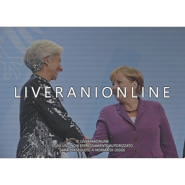 (111006) -- BERLIN, Oct. 6, 2011() -- Managing Director of International Monetary Fund (IMF) Christine Lagarde (L) shakes hands with German Chancellor Angela Merkel (R) during a press conference after a high-level meeting on the reform of the international monetary system in Berlin, capital of Germany on Oct. 6, 2011. (/Ma Ning) AG ALDO LIVERANI S A S ONLY ITALY