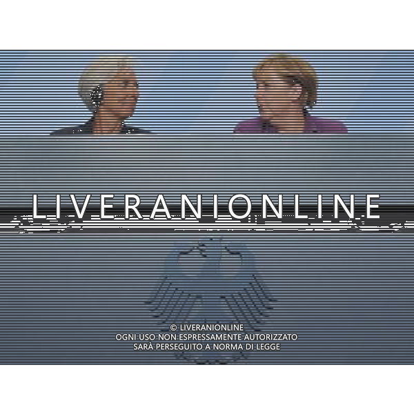 (111006) -- BERLIN, Oct. 6, 2011() --- Managing Director of International Monetary Fund (IMF) Christine Lagarde (L) and German Chancellor Angela Merkel attend a press conference after a high-level meeting on the reform of the international monetary system in Berlin, capital of Germany on Oct. 6, 2011. (/Ma Ning) AG ALDO LIVERANI S A S ONLY ITALY